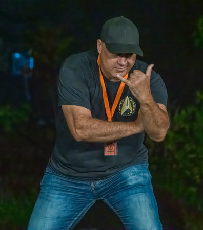 Honolulu, Hawaii/USA - 2022-08-20 - Shaka Filming Hukilau - man poses while flashing a shaka.のeditorial素材