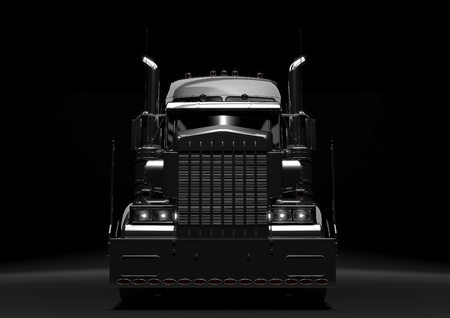 Front view of a long black diesel truck in a dark backgroundの写真素材