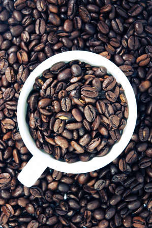 coffee cup on coffee beansの写真素材
