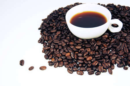 coffee cup on coffee beansの写真素材