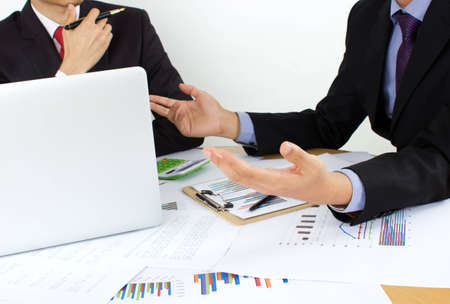 two business men review the documentsの写真素材