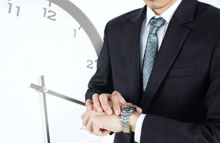 Businessmen looking at his watchの写真素材