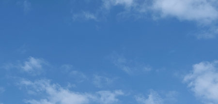 White clouds floating against a vivid blue sky. Beautiful cloud photography with perfect height,...