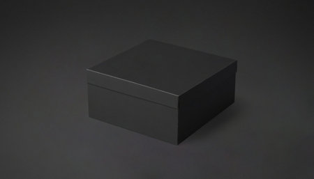 Black square box closed on a black background. Premium photo mockup for elegant and clean cardboard...