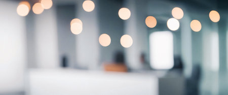 Blurry image depicting a modern office interior with soft lighting and a calm atmosphere.の写真素材