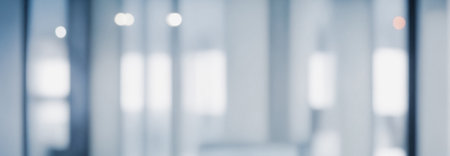 Image shows a blurry abstract representation of a modern minimalist office interior with soft lighting. Premium modern bokeh photos for poster, banner and print backgrounds.の写真素材