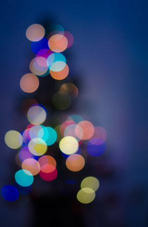 Defocused christmas tree with colorful lightsの写真素材
