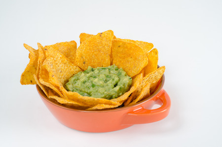 Nachos with guacamole on white backgroundの写真素材