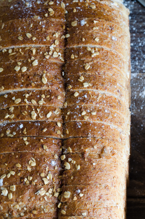 Rustic bread cut into slices. Vertical plane.