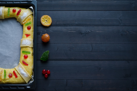 Kings thread frosted fruit ornament, before baking and dark wood bottom, horizontal plane. With room to write to the right.の写真素材