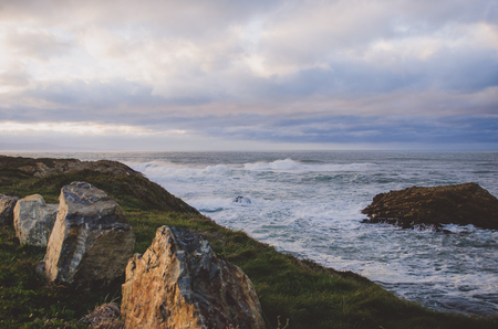 Coastal landscape on a cloudy day of rainstorm.