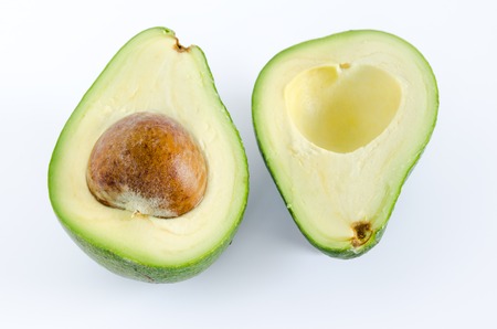 Avocado cut in half on white background. Top viewの写真素材