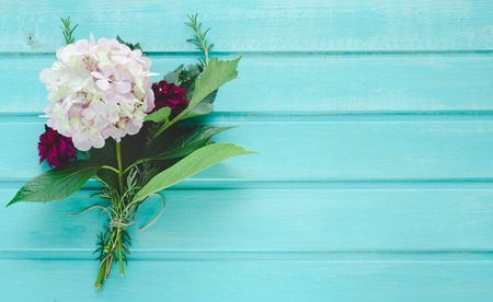 Hydrangea and dahlia on blue background. Space to write. Top view.の写真素材