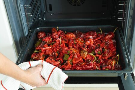 Baking tray with roasting peppers.の写真素材
