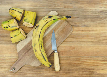 Ripe banana on a wooden base. Copy space.の写真素材