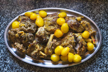 Meat and potato stew on a tray. Homemade food concept.