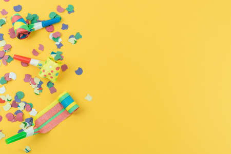Party decorations for the end of the year and birthdays on a yellow background. Copy space.の写真素材