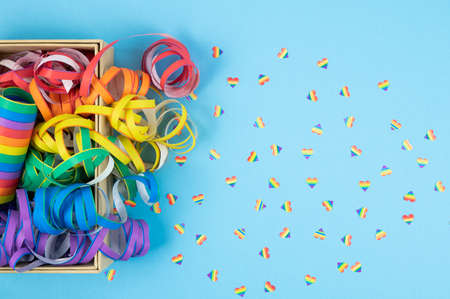 Colored ribbons on blue background. Colorful spirals LGBTQIA culture.の写真素材