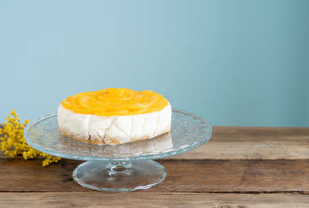 Three milks dessert decorated with peaches in the shape of a rose. Copy space. Colombian recipe. Pastry concept.の写真素材