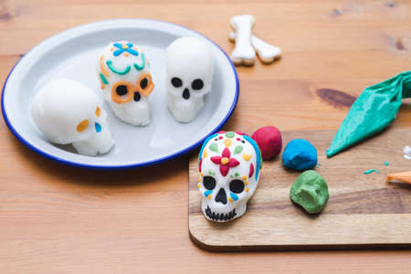 Day of the dead in Mexico. Decoration process of skulls for Day of the Dead. Copy space. Mexican party. Handmade.の写真素材