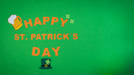 St. Patrick's Day. Banner design on green background with HAPPY ST. PATRICKS DAY and decorations of beer, horseshoe, shamrock and hat. Copy space.の写真素材