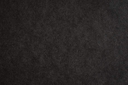 Black paper texture. Macro photography of book cover.の写真素材