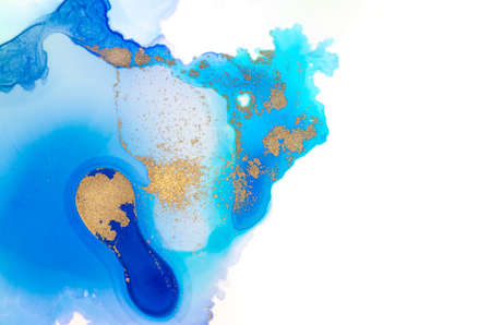 Texture of alcohol ink in blue tones with gold on white background. Copyspace.