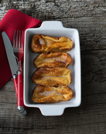 French toast. Typical food of Spain at Easter. Copyspace. Torrijas in white tray. top view. vertical pictureの写真素材