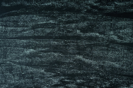 Dark textured background painted with chalk. Free space for text.の写真素材