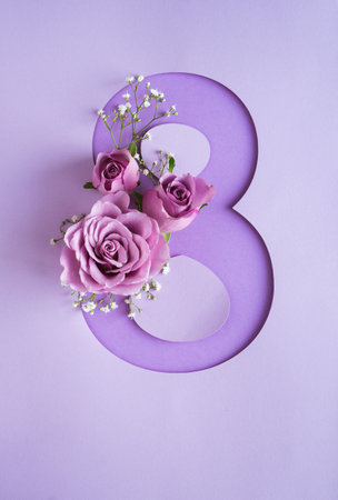 Violet roses with number 8. International Women's Day. Purple background.の写真素材