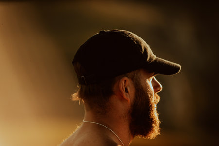 An athlete rests on top of a mountain after exhausting running training.の写真素材