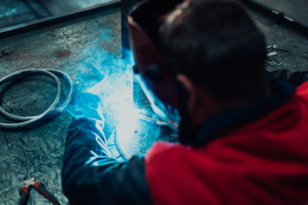 Close up of the steel welding process. Work in the heavy steel industryの写真素材
