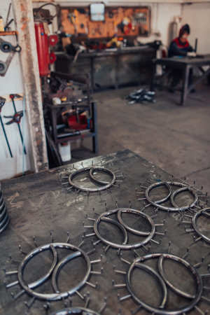 Pieces of steel lined up on the table ready for the welding processの写真素材