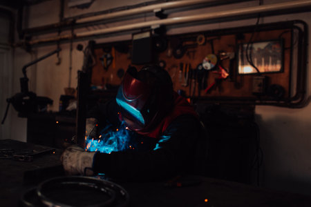 Welder erecting technical steel. Industrial steel welder in factory technicalの写真素材