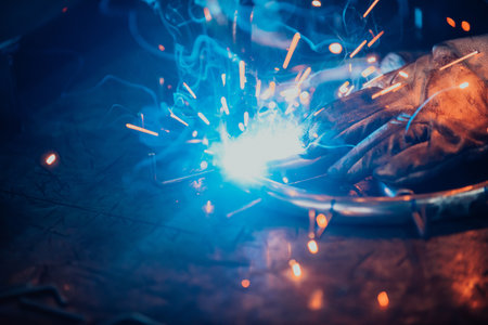 Close up of the steel welding process. Work in the heavy steel industry