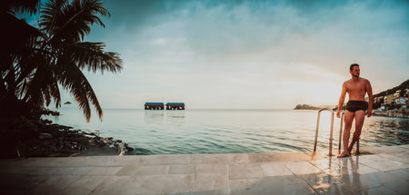 Sexy Fit man posing at the beach.の写真素材