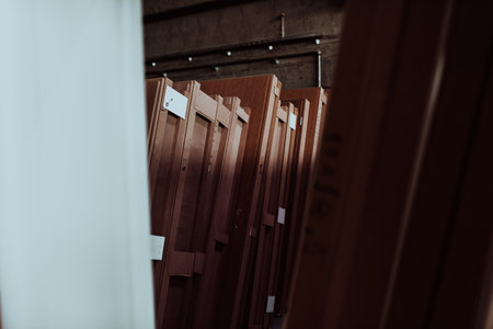 A vast warehouse in the forestry industry, showcasing a plethora of wooden products, including boards and various timber items neatly organized in storageの写真素材