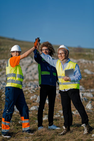 Engineers Collaborating in the Field to Inspect and Optimize Electric Turbines.