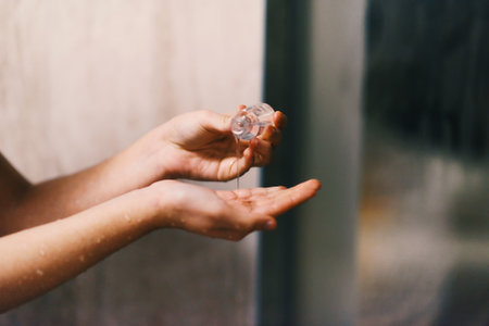 Close up shot, a woman applies hydrating cream to her hand, indulging in a daily skincare ritual...