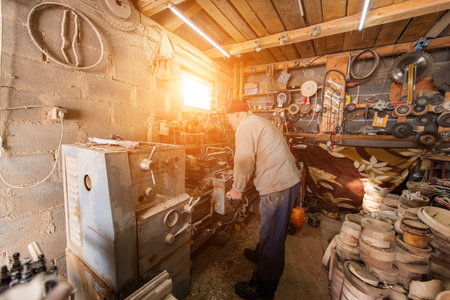 Elderly Craftsman Working in a Rustic Workshop