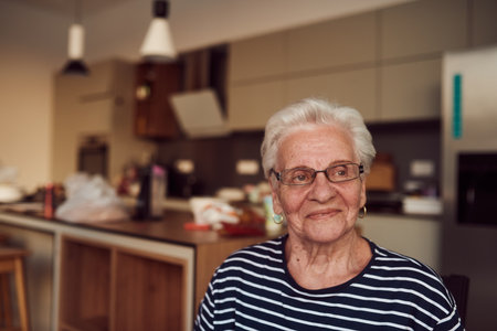 Unfiltered portrait, a real elderly woman sits gracefully in a chair, showcasing the authenticity of...