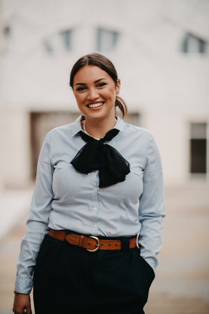 Smiling Latina woman stands confidently.の写真素材