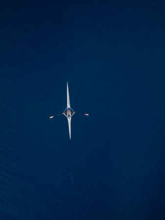 Single Rowing Boat on Deep Blue Seaの写真素材