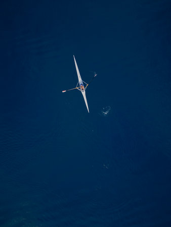 Single Rowing Boat on Deep Blue Seaの写真素材