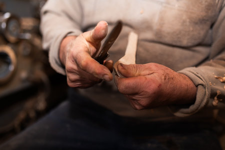 Woodworker Carving Wooden Bowl With Knife In Workshop Crafting Wood Products Woodworking Industry And Carpentrの写真素材