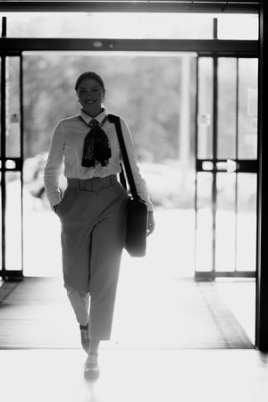 Latina businesswoman radiating confidence and style as she navigates the urban shopping center.