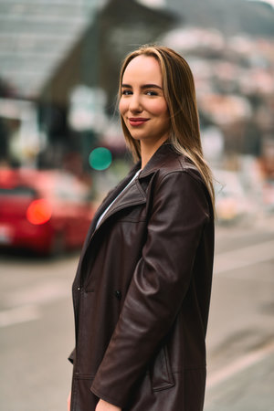 A Casual Girl Poses with Confidence and Style on Urban Streetsの写真素材