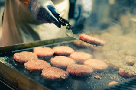 preparing tasty grilled hamburgers