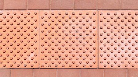 Brick pavement tile, top view. Urban texture as background.
