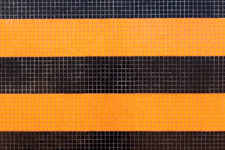 Colorful ceramic tiles mosaic - orange and black. Background textureの写真素材